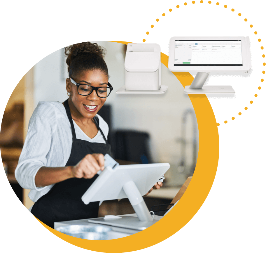 Woman using point of sale terminal to process credit card.